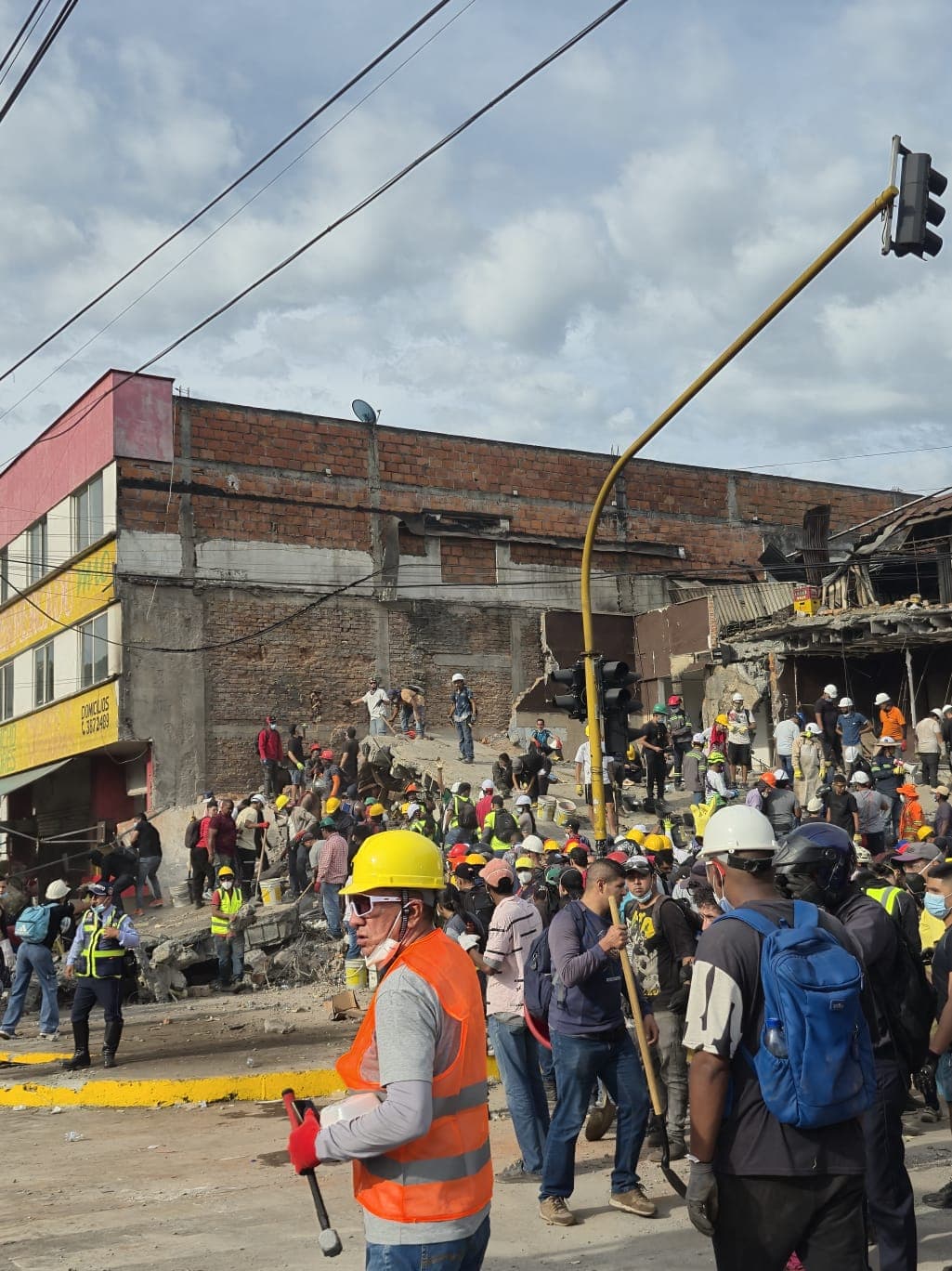 Rescue workers outside a collapsed building in Colombia